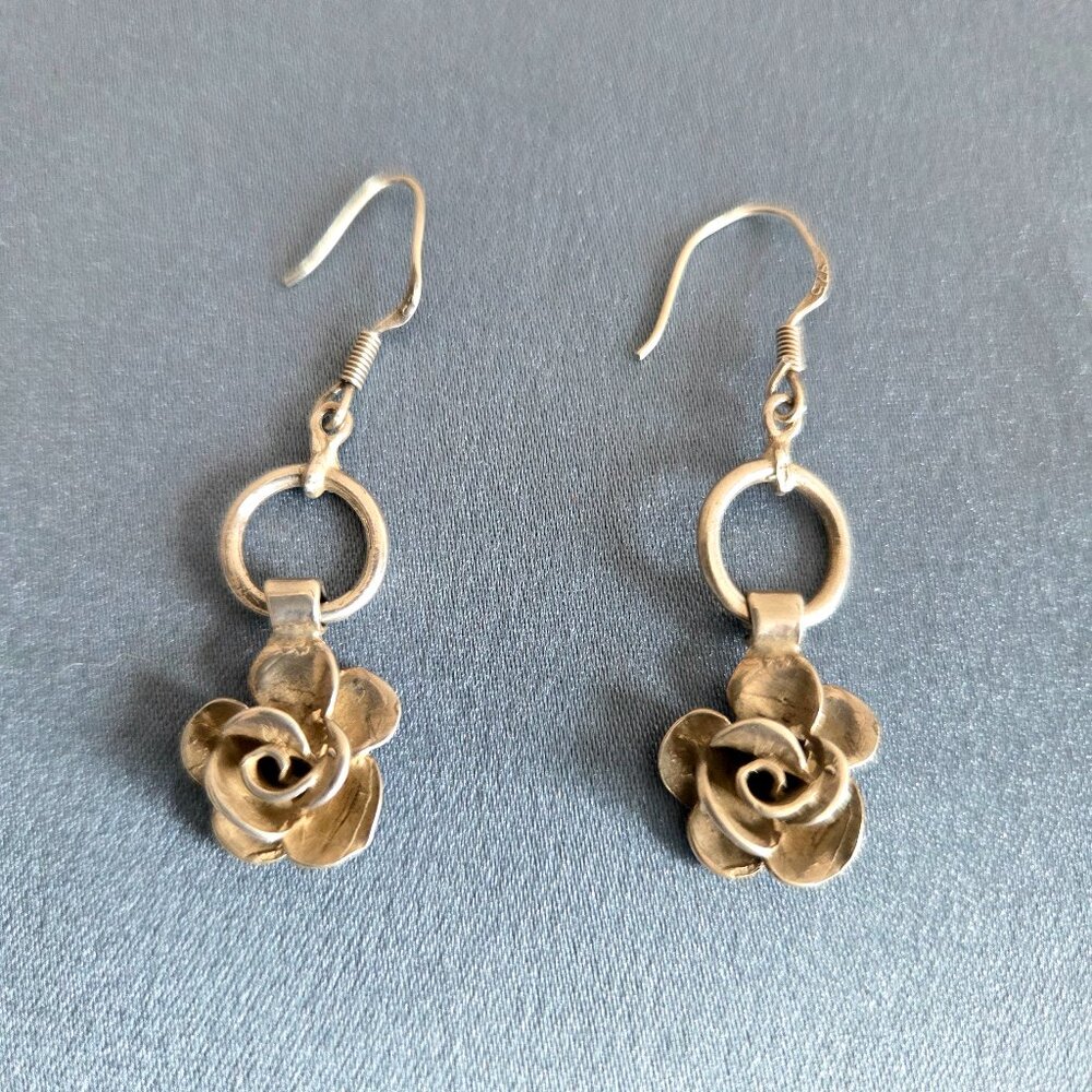 Vintage sterling silver earrings with dangling flowers.